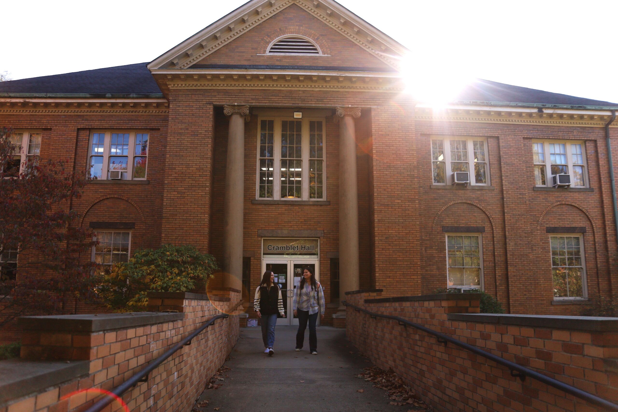 Two students walking out of Cramblet Hall